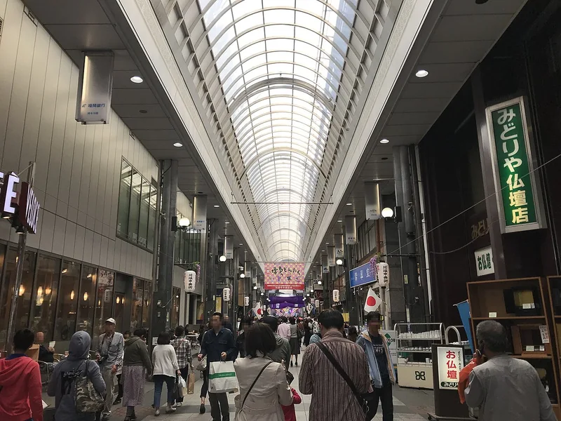 Visitors walking through the covered Kawabata shopping arcade in Hakata