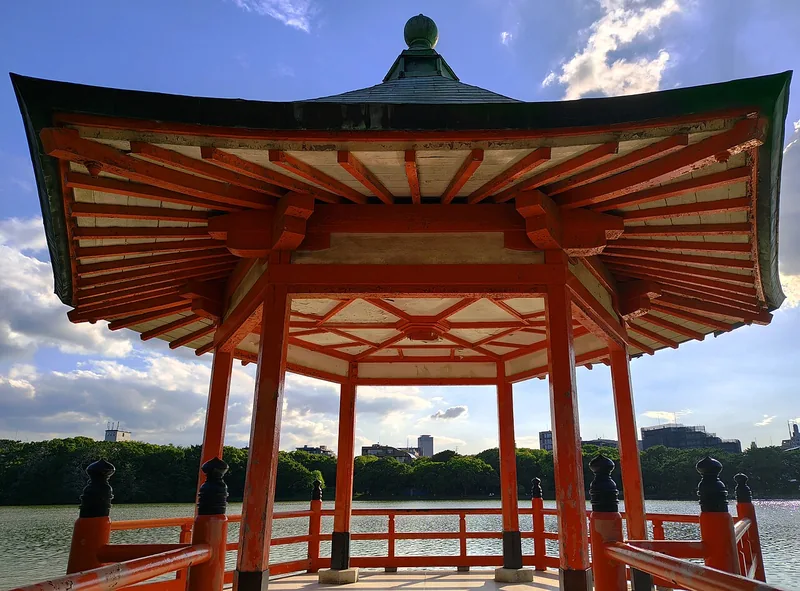 The red Ukimido pavilion beside the lake in Ohori Park
