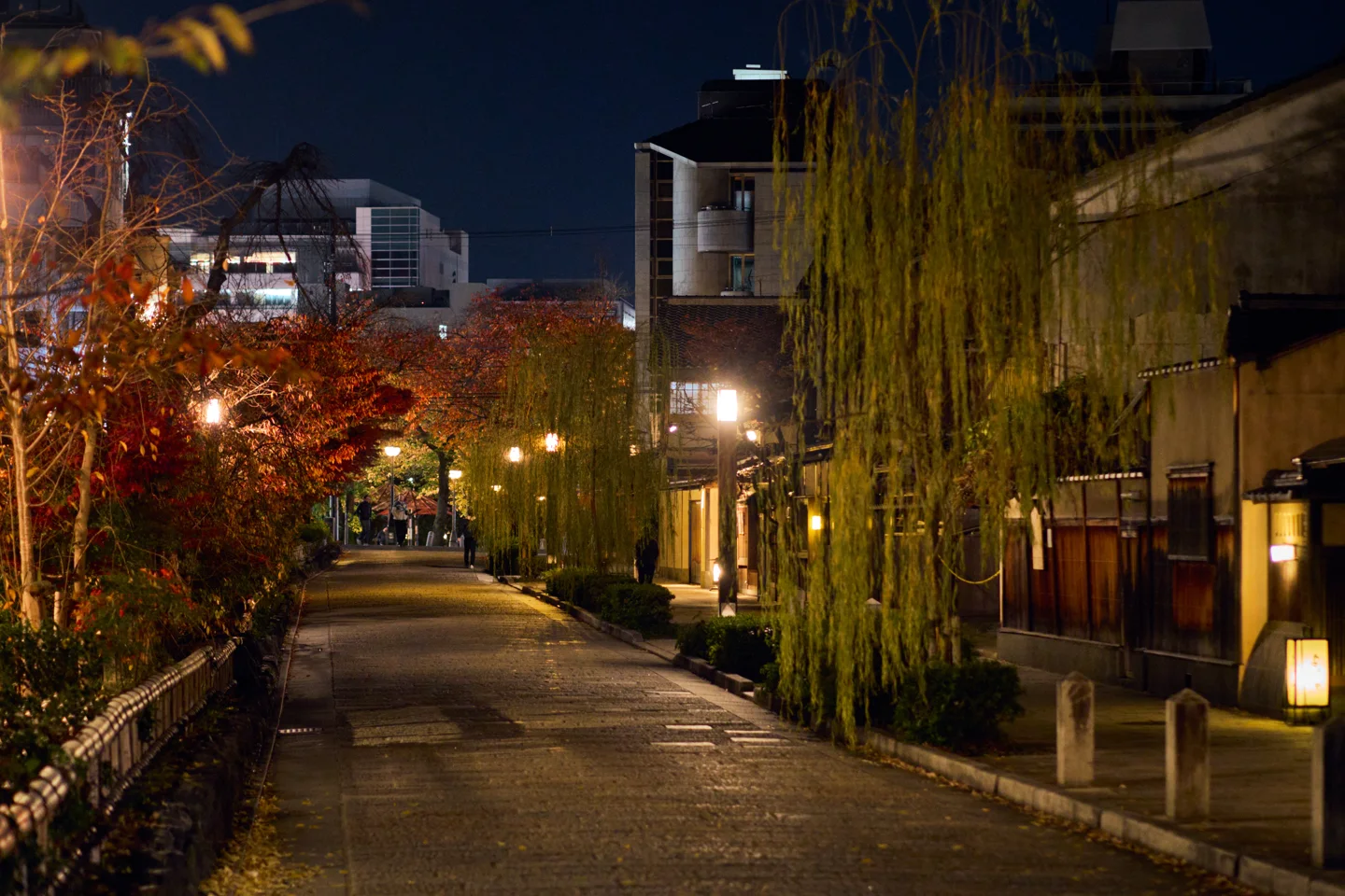 Gion's stone-paved streets and traditional townhouses at night