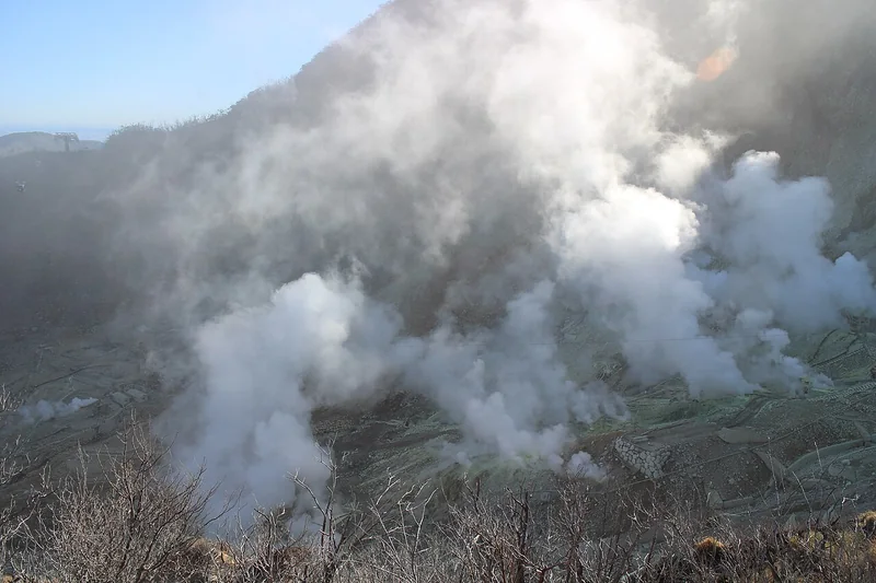 Steam rising from the volcanic slopes of Owakudani