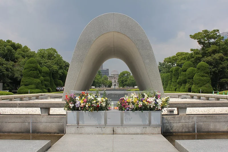 The arched Cenotaph and flowers at Hiroshima Peace Memorial Park
