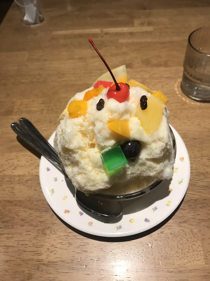 Shirokuma shaved ice with fruit at Tenmonkan Mujaki in Kagoshima
