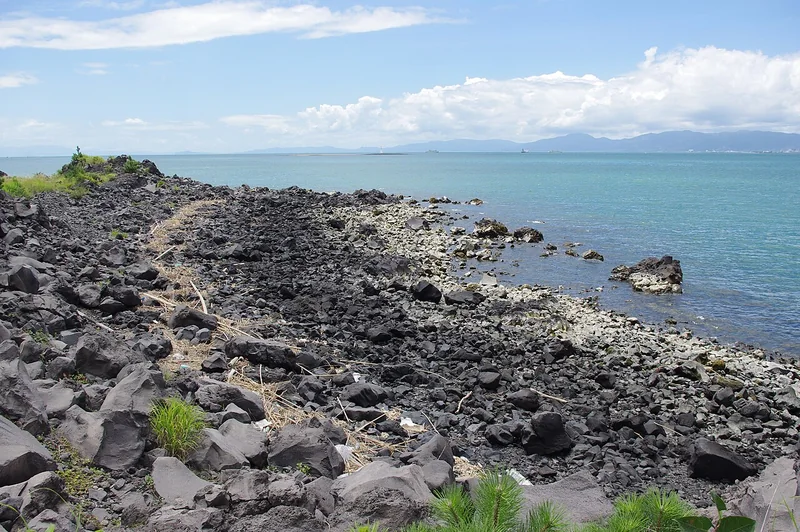 Lava rocks beside the blue sea along Sakurajima’s Nagisa Lava Trail
