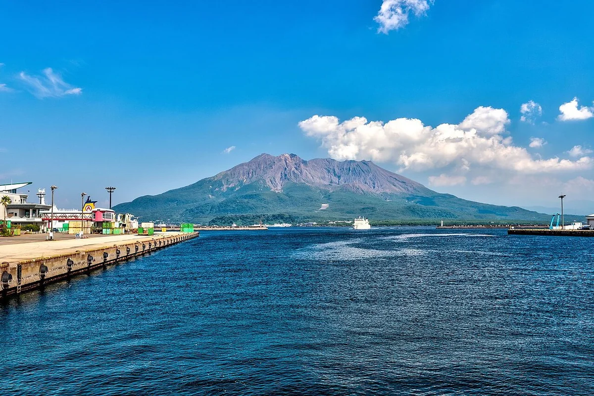 Sakurajima and the blue waters of Kagoshima Bay viewed from Waterfront Park