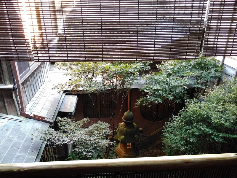 A courtyard garden viewed from inside Shima teahouse