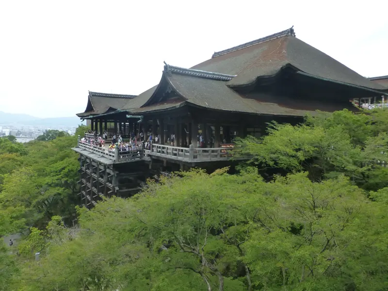 Kiyomizu-dera's wooden main hall above green trees