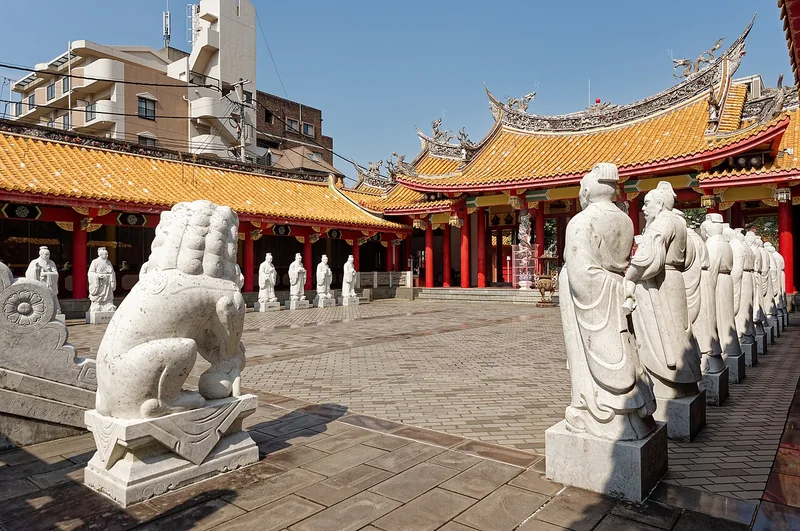 Stone figures and colourful roofs in Nagasaki’s Confucian Shrine courtyard
