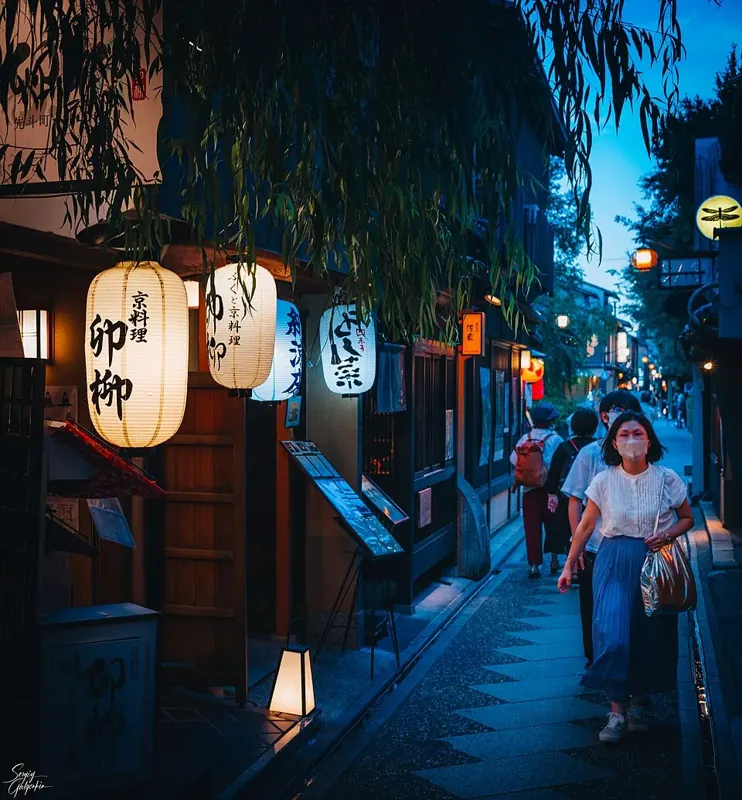 Pontocho's narrow restaurant lane illuminated at night