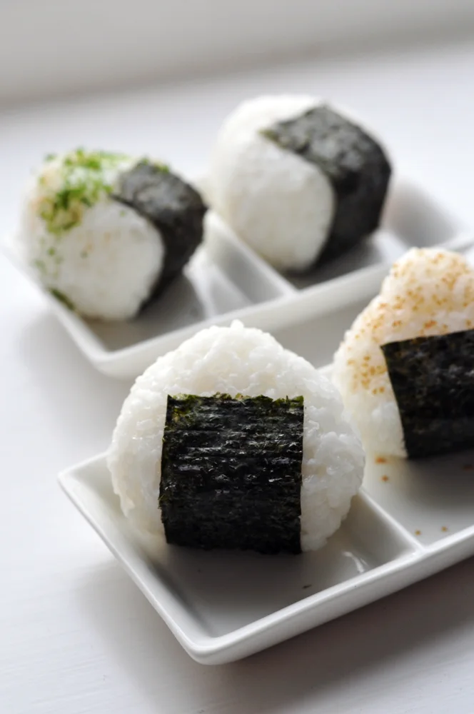 Rice balls with nori; the fillings are not visible.