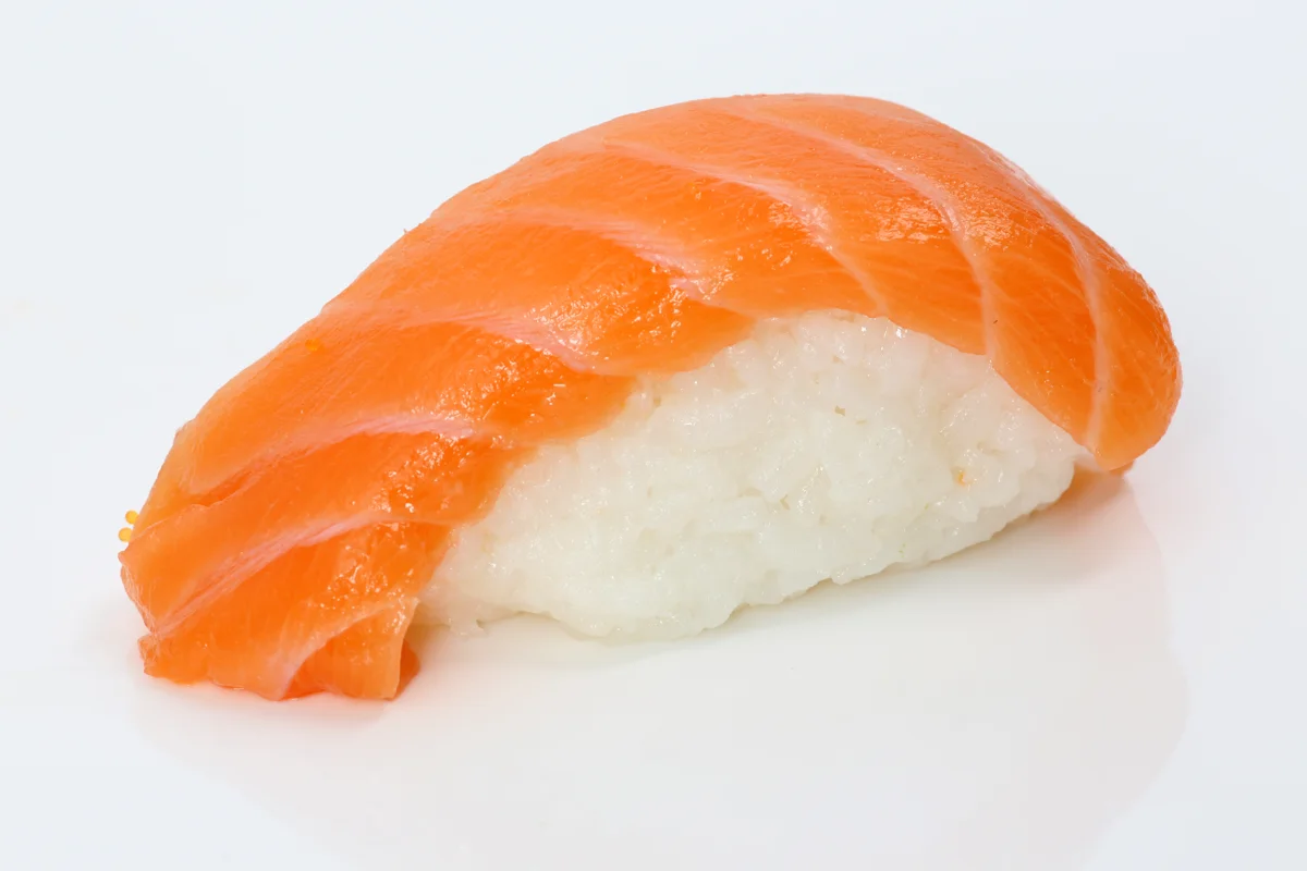 Salmon nigiri, a fish topping over sushi rice.