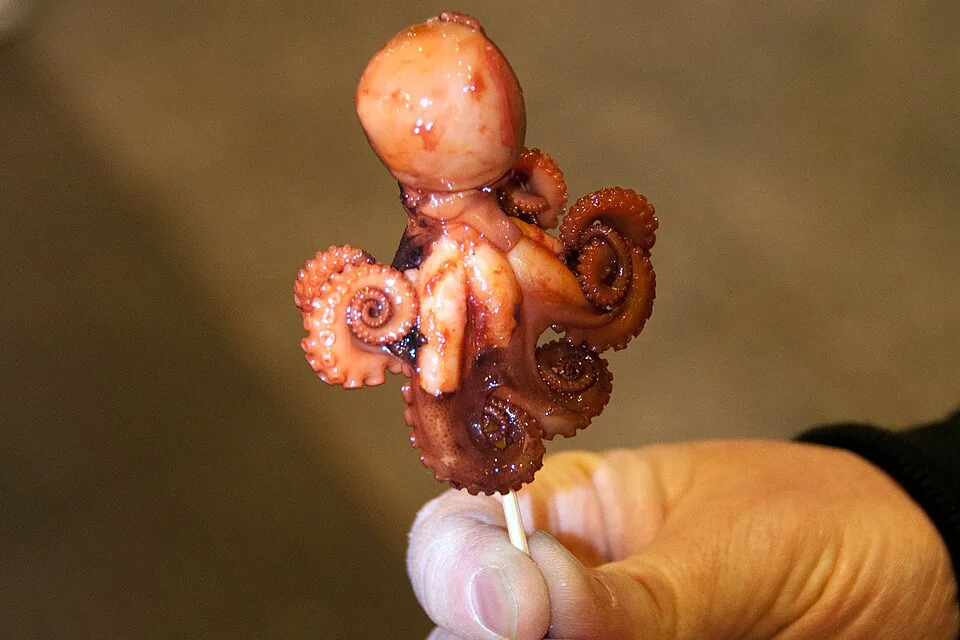 A cooked baby-octopus skewer at Nishiki Market.