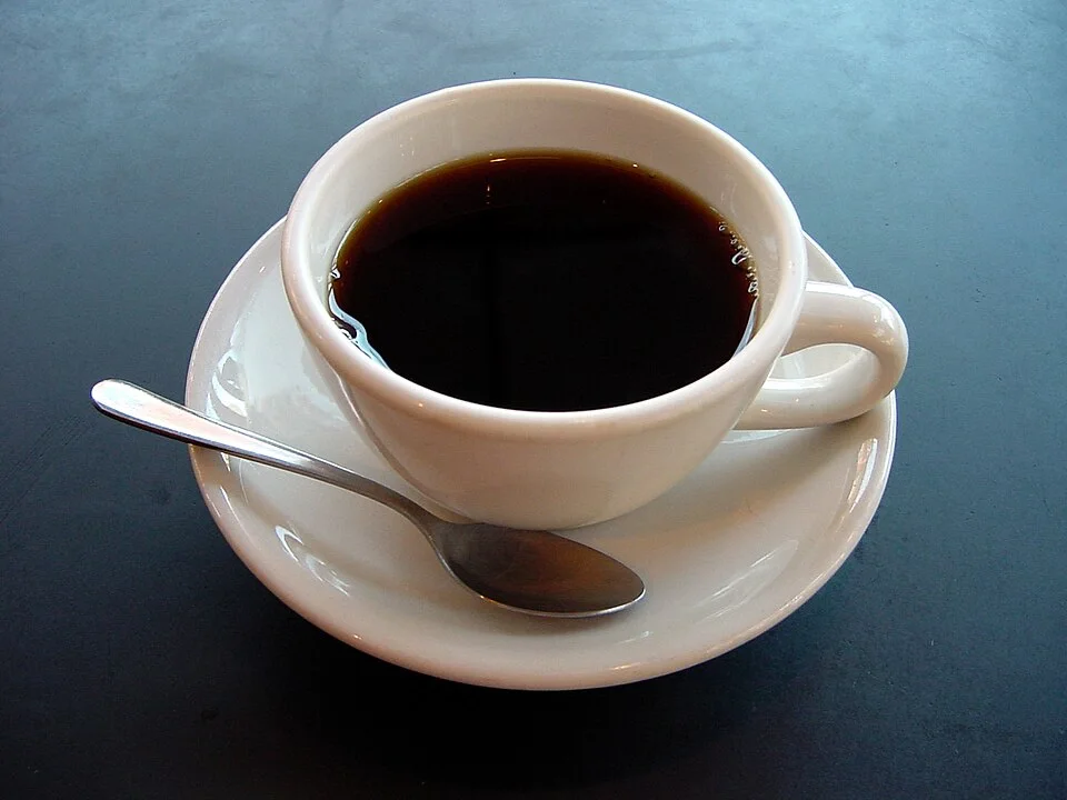 A small cup of black coffee.