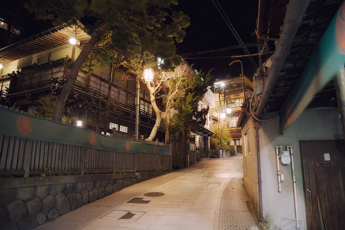 Lanterns lighting a narrow street in Shibu Onsen at night