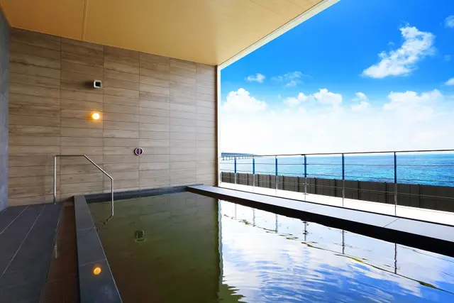 The sea-facing hot-spring bath at Henn na Resort & Spa Kansai Airport