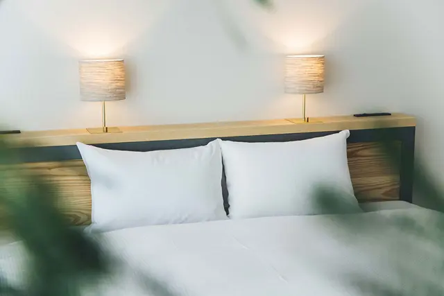 A softly lit guest room at Hotel Noum OSAKA