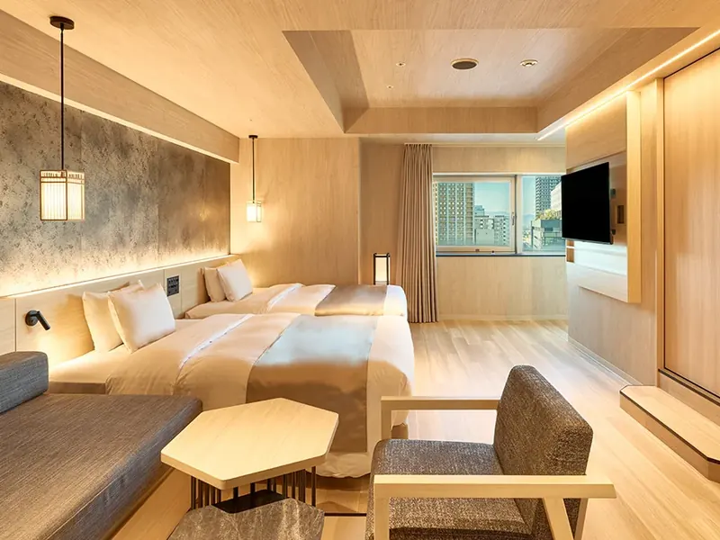 Warm timber guest room at One Station Hotel Kumamoto