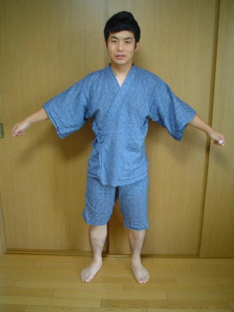 A blue two-piece jinbei being worn
