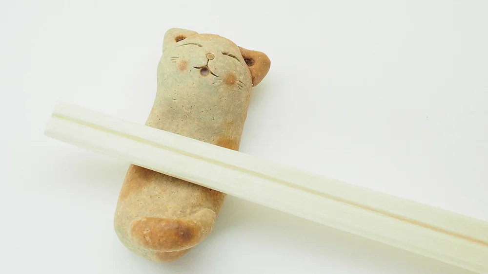 A small bear-shaped chopstick rest