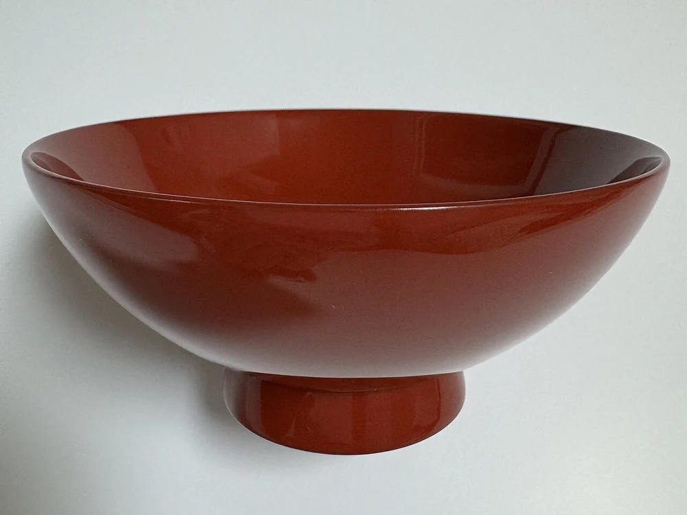 A red Wajima-nuri lacquer rice bowl