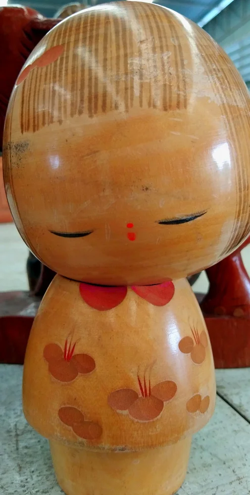 A wooden kokeshi doll