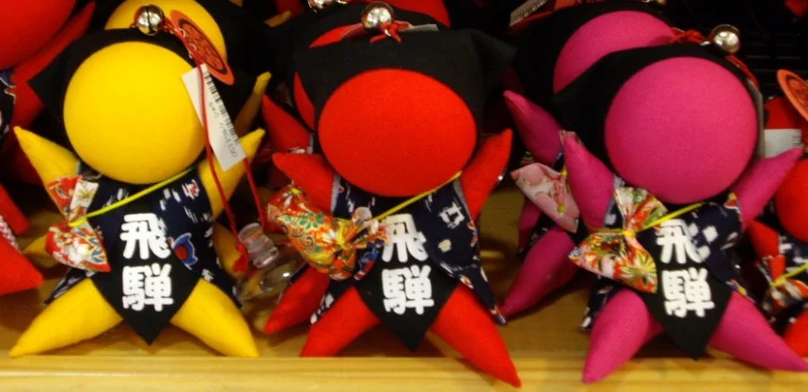 Colourful sarubobo figures