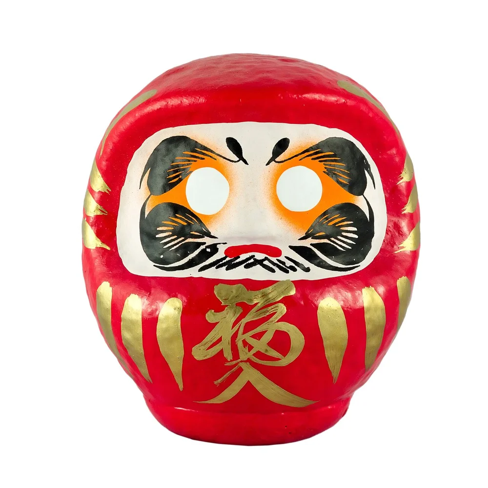 A red daruma figure