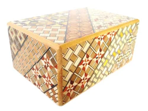 A Japanese secret-opening puzzle box with marquetry
