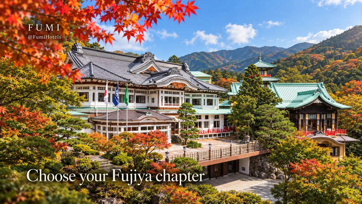 Fujiya Hotel’s white historic facades and layered tiled roofs among Hakone’s wooded hills.