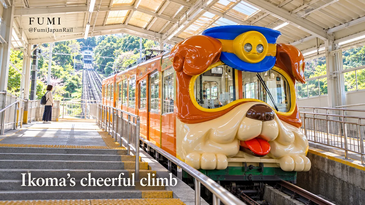 The dog-faced Bull funicular waits beside a covered platform on the Ikoma cable line. Original Fumi illustration.