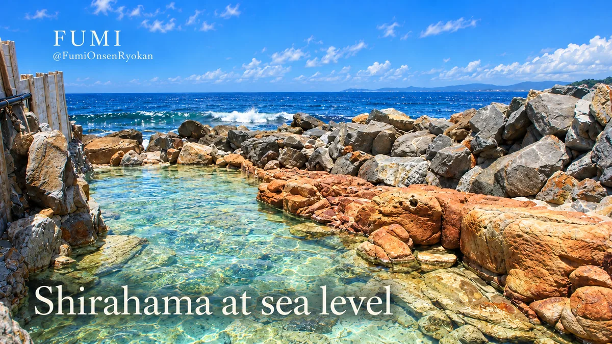 The empty Saki-no-yu rock bath at Shirahama, with clear water beside Pacific waves. Original Fumi illustration.