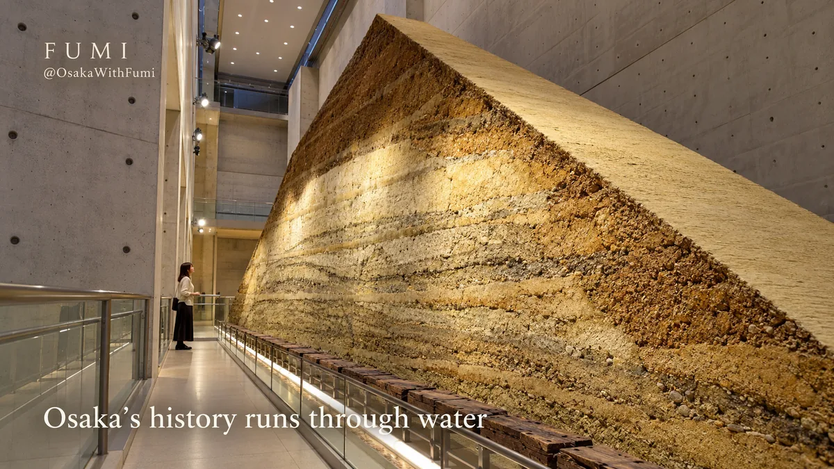 The huge layered earth section of an old reservoir embankment inside Sayamaike Museum’s concrete gallery. Original Fumi illustration.