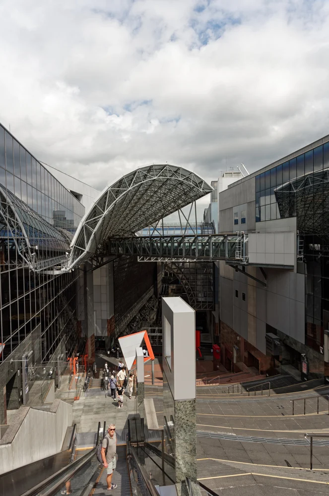 The open atrium and curved roof of Kyoto Station.